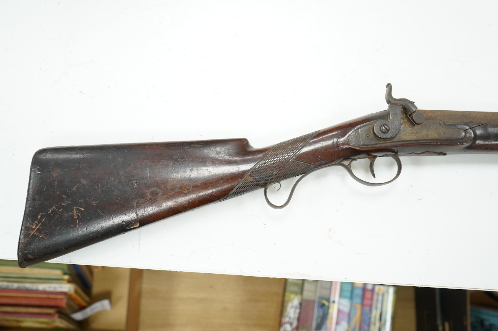 A 12 bore single barrel percussion sporting gun by J. Aston, the drum converted from flintlock, with engraved iron mounts, half stocked